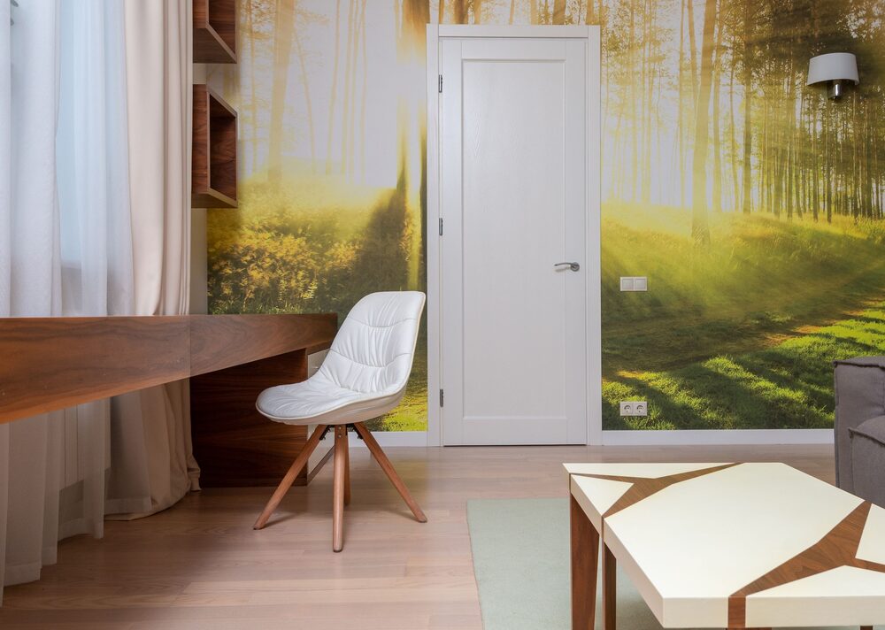 Sitting room and study with a serene forest scenic mural wallpaper